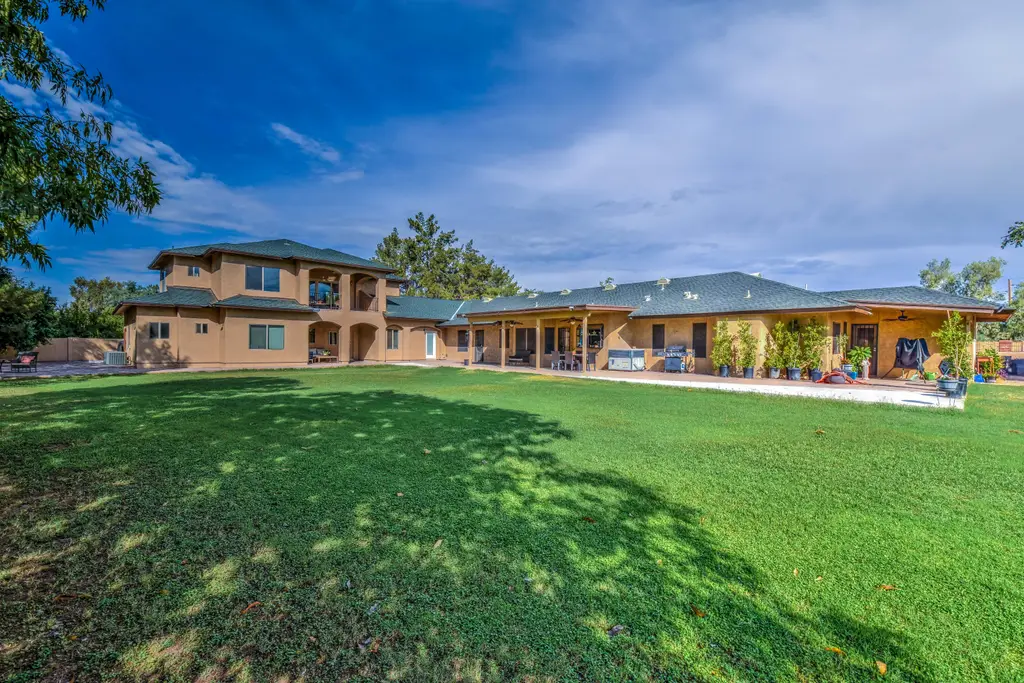 Lush green lawn and mature shade trees on the Solstave property